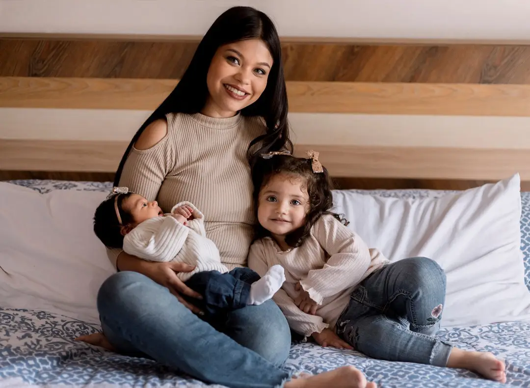 Woman holding a little girl in lap