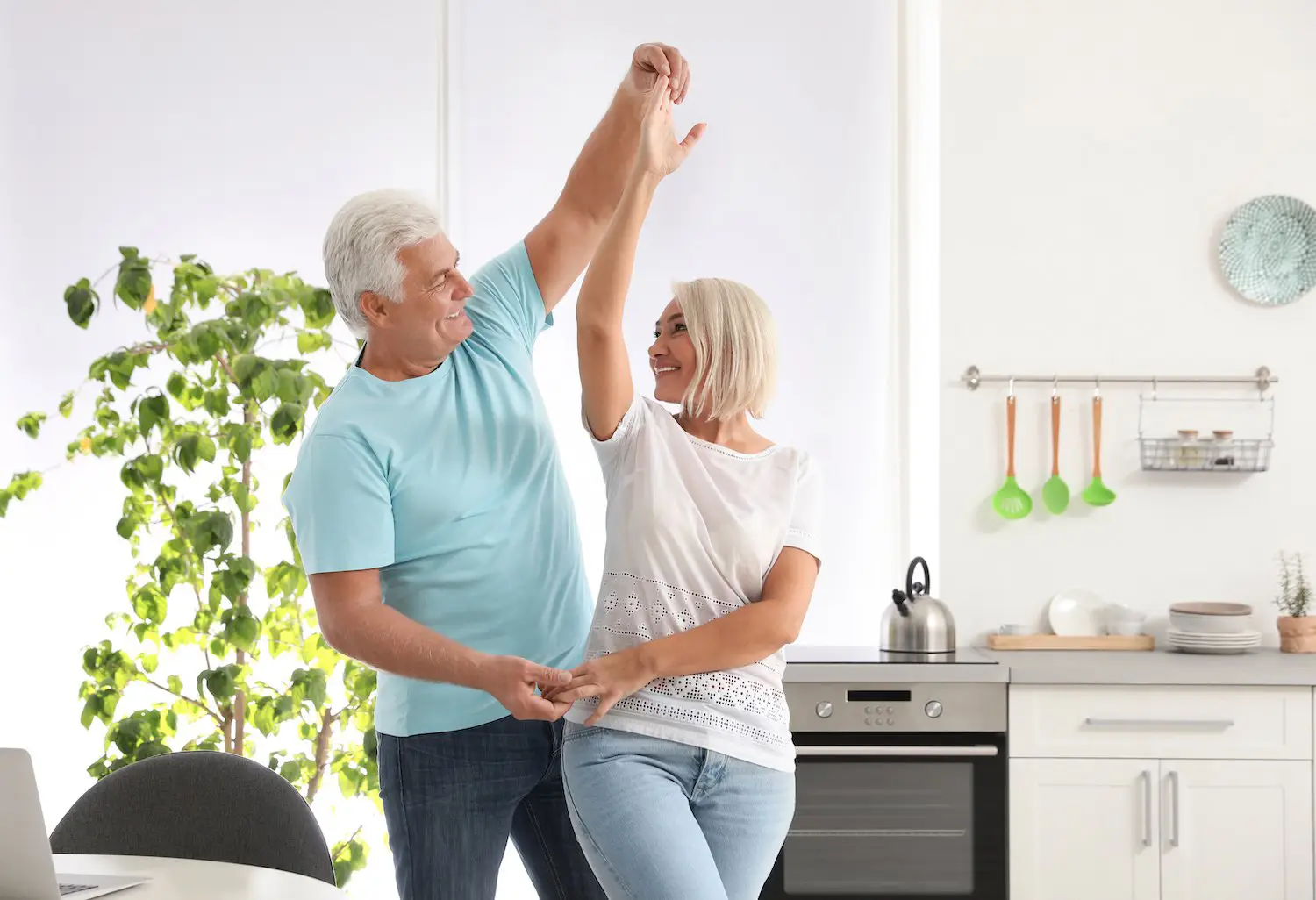 Elderly couple dancing and healthy