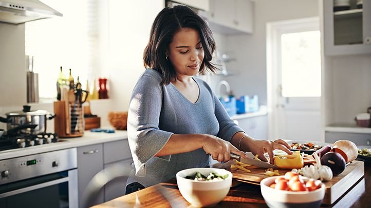 Woman cutting vegetables