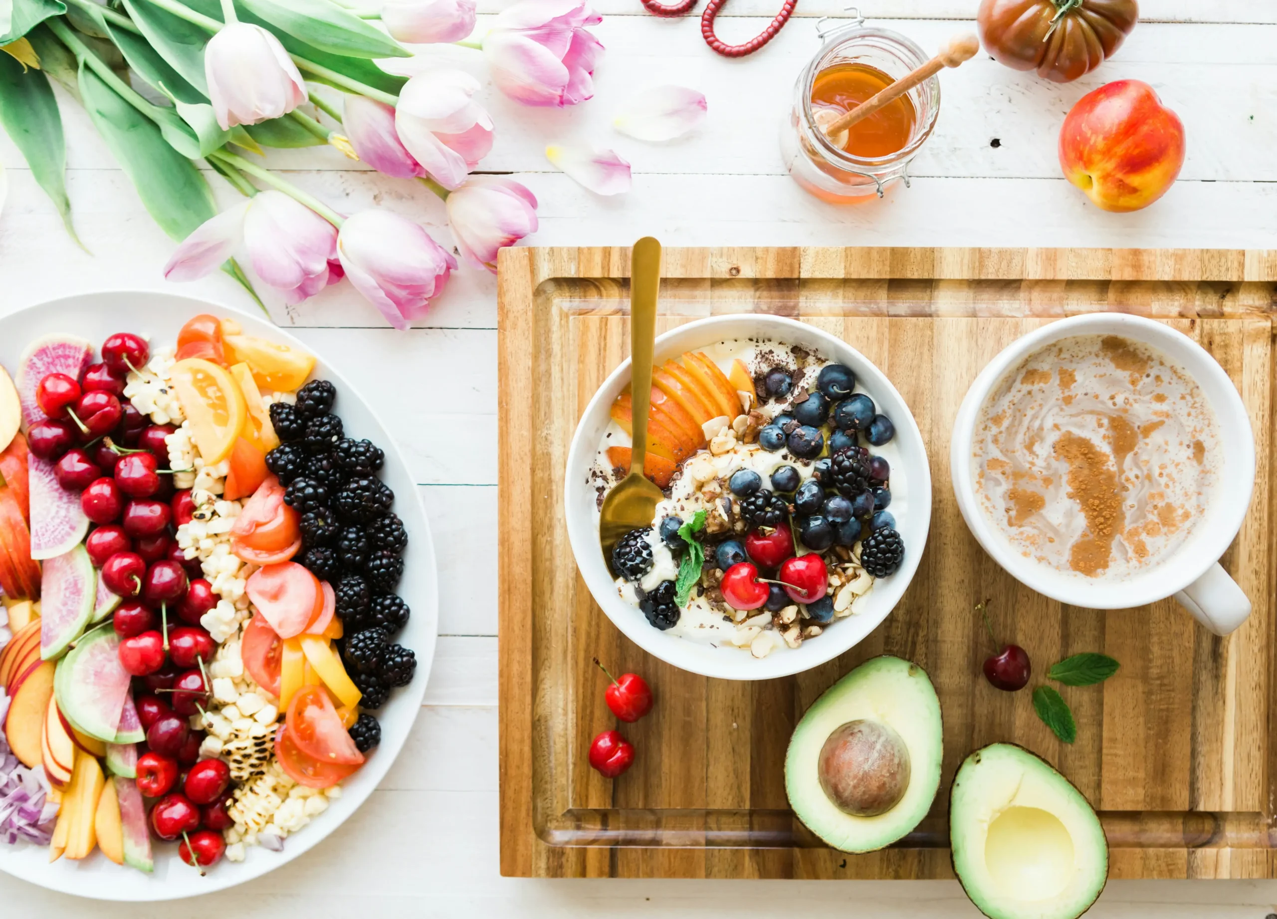 Assortment of healthy, colorful foods laid out on a table